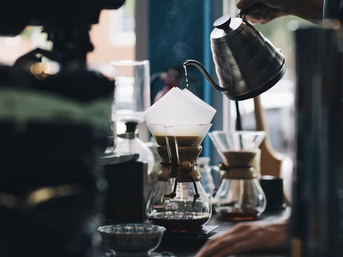 Pour-over coffee being brewed by hand, one cup at a time